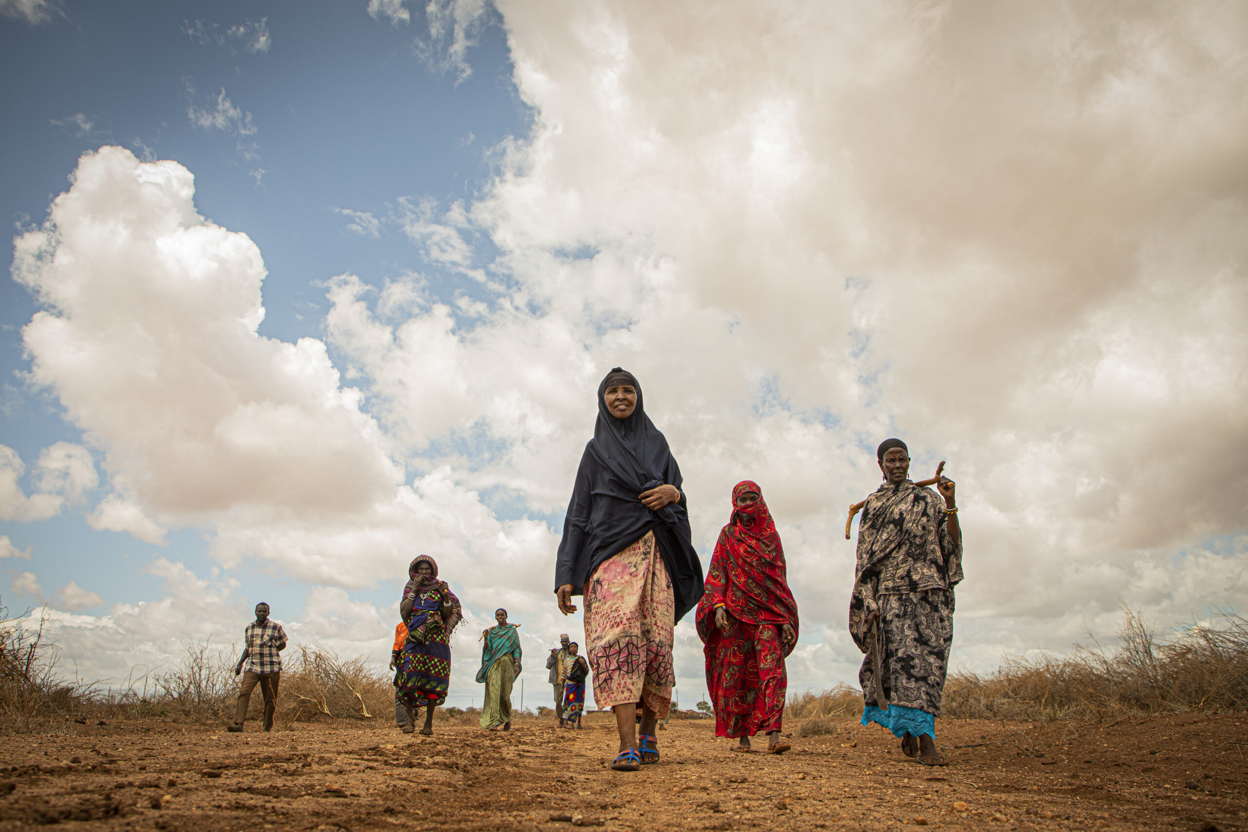 women walking in arid lands