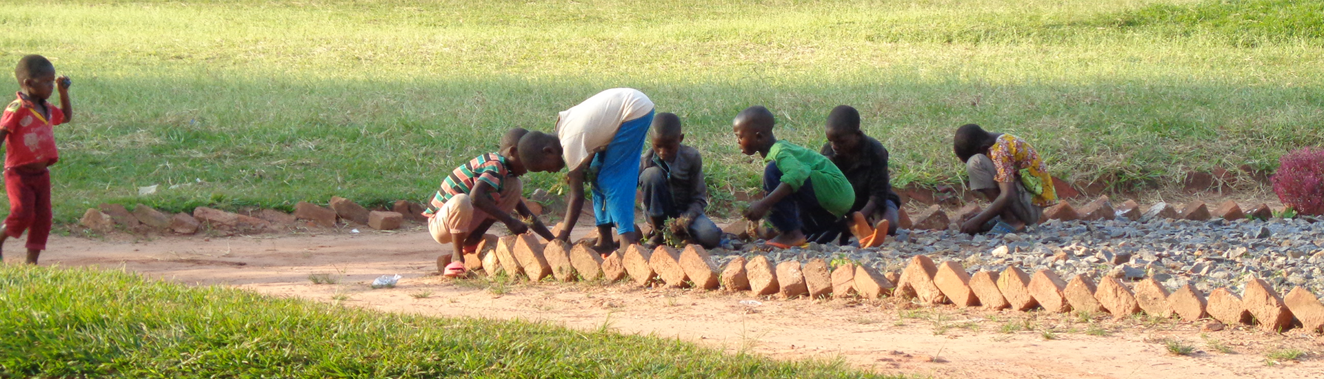 boys playing on the ground in Democratic Republic of the Congo