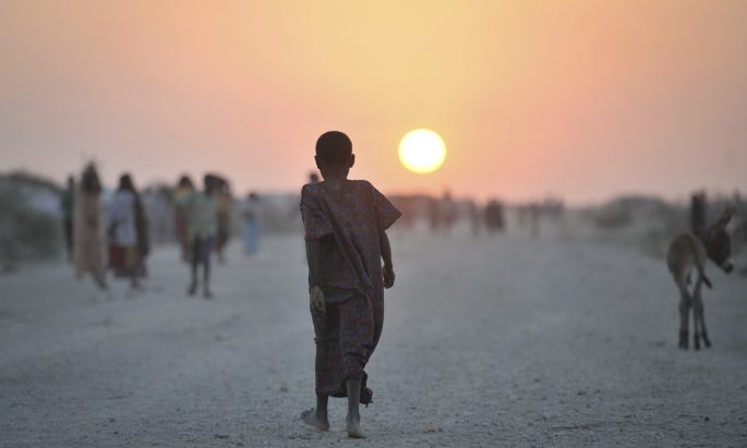 kid and sunset in IDP camp in Somalia