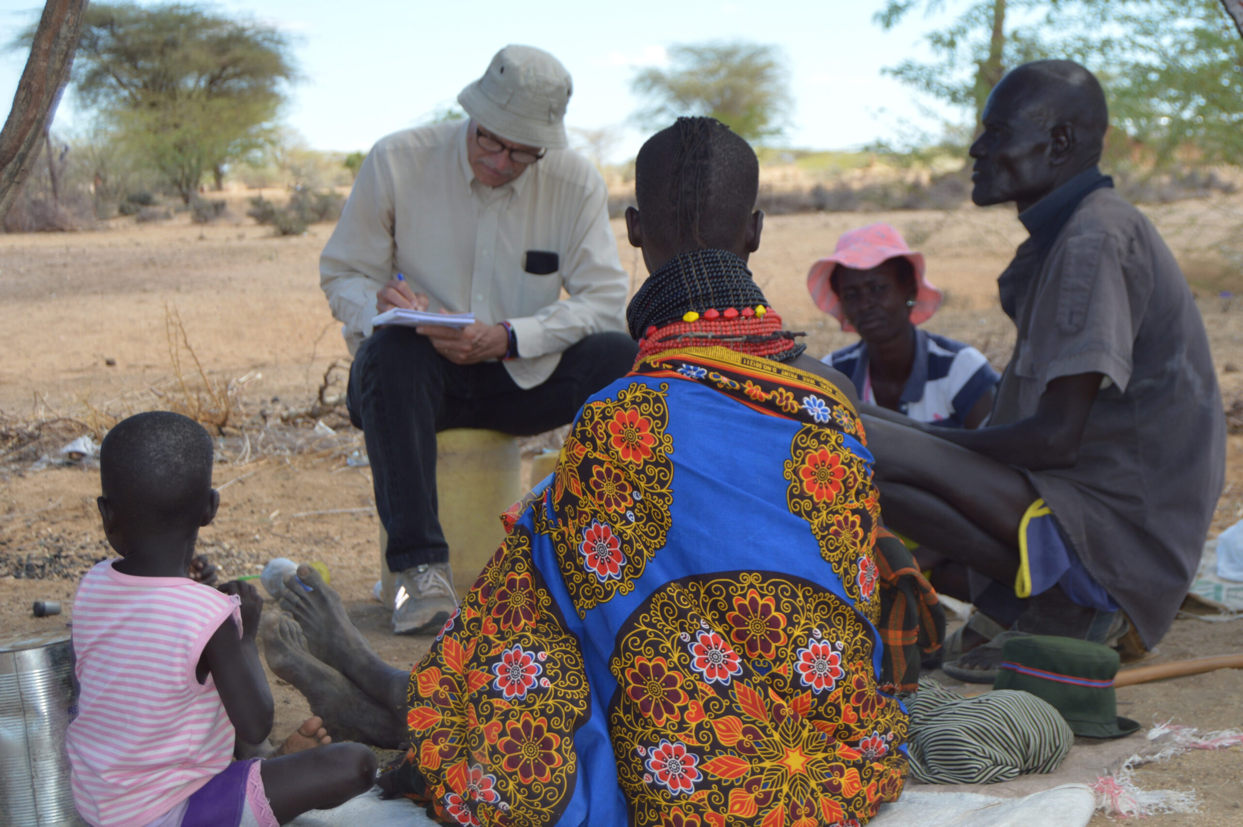 Researcher Dan Maxwell interviews local people in Kenya