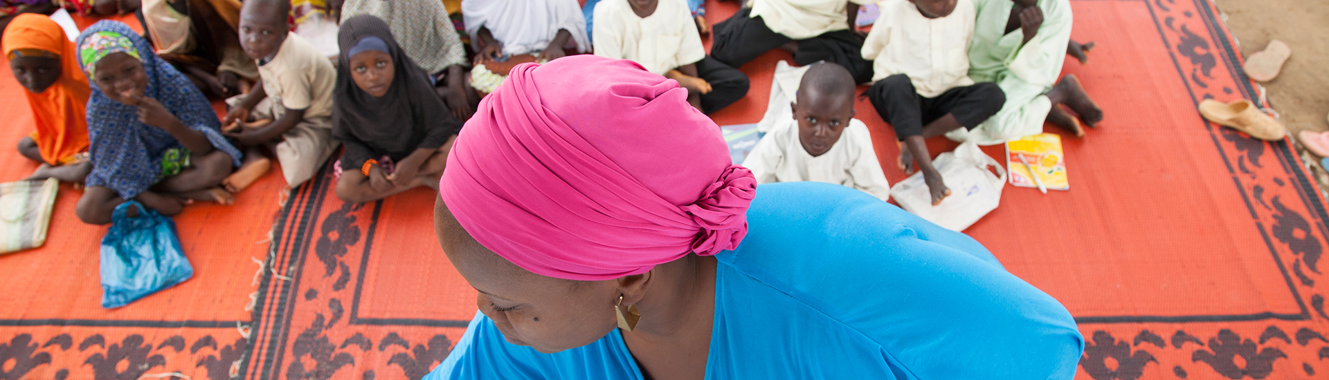 Damisa Rahila, a volunteer of the USAID funded SMILE activity teaches children In Sakwatawa, a small community in Nasarawa state, Nigeria. USAID Africa